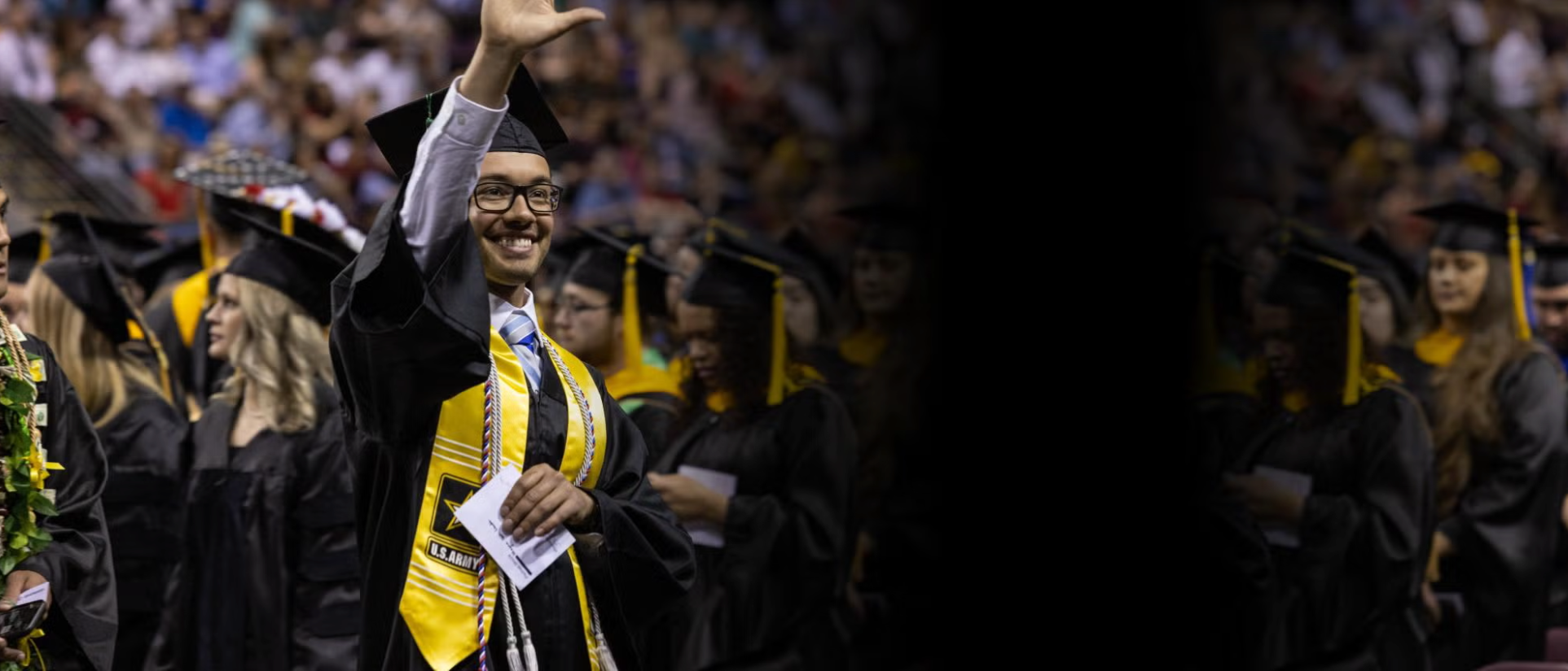 Student Graduating and Waving
