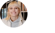 Blonde woman with bangs with big smile.