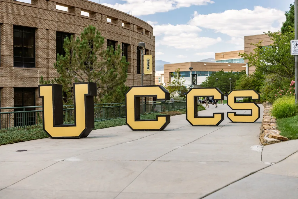 large UCCS letters on the main campus sidewalk