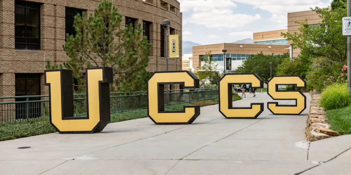 large UCCS letters placed on the main campus sidewalk