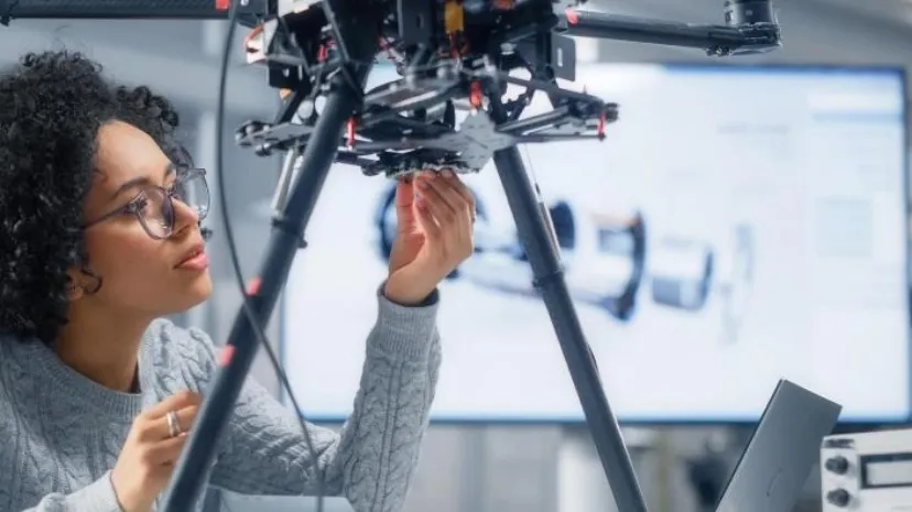 Image of woman working on equipment